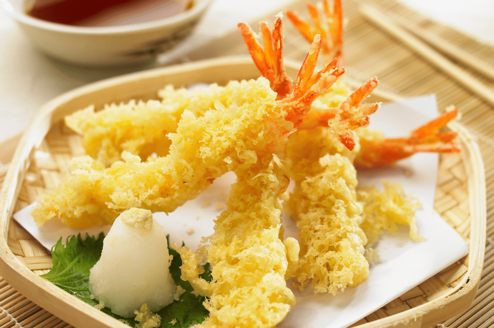 Fresh Japanese Tiger Prawn tempura, delicately battered and fried to a golden crisp, served on a bamboo tray with shiso leaf, grated daikon, and ginger—an elegant moment in Yamato’s omakase sequence, where restraint and refinement meet expert scrutiny.