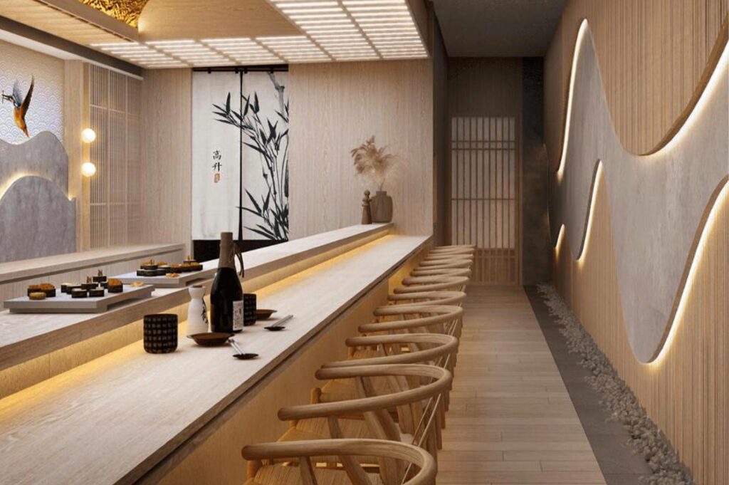 Luxury sushi bar interior with a long wooden counter, curved back chairs, warm ambient lighting, and elegant Japanese bamboo wall art.